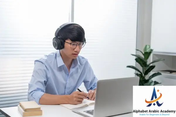 student fron of lap Learn Quranic Arabic from Scratch Online Course: From Zero to the full Message