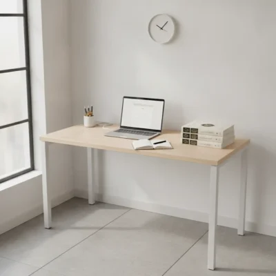 Minimalist home office desk setup with laptop, notebook, and pen; stack of books on the right and a small pencil holder nearby in a bright room